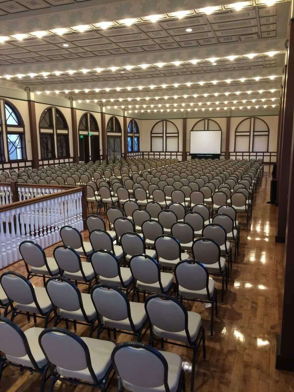 brigham academy center with chairs facing stage